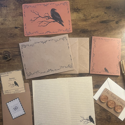 Correspondence Corner — Autumn 2026, flat lay with raven postcard, seasonal writing sheets, envelopes, archive card, wax seals, and pen.